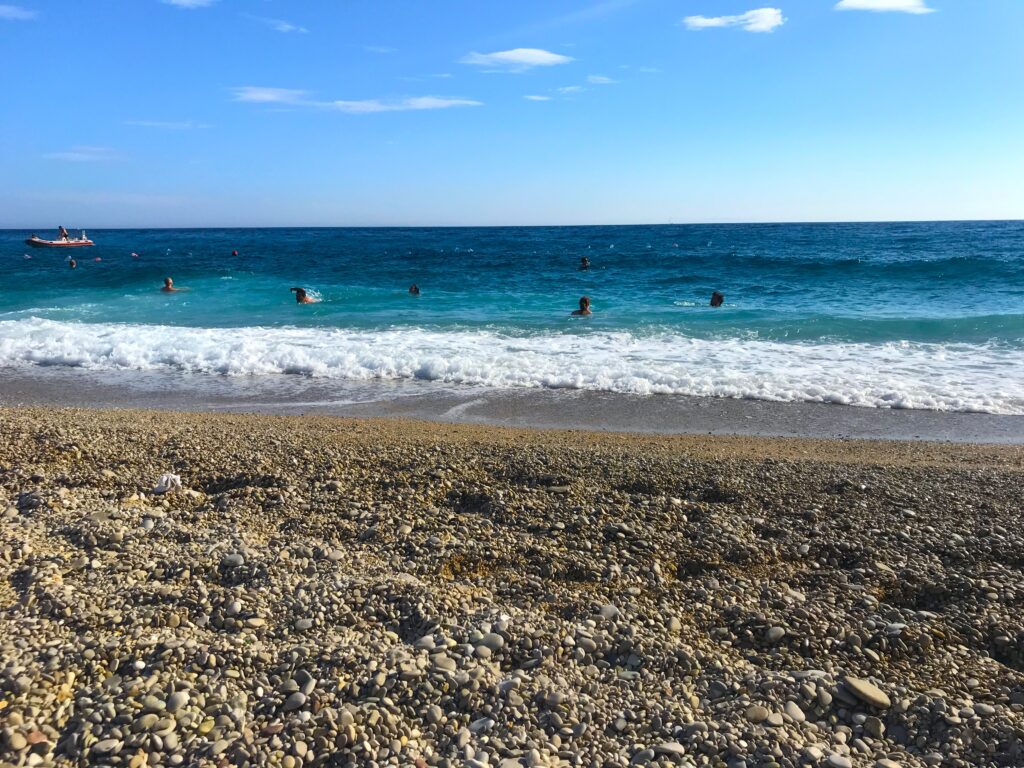 People swimming in the sea at Gjipe Beach