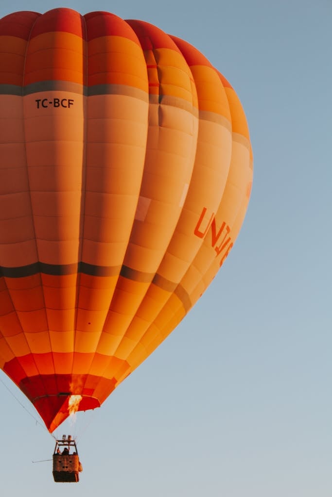 Orange Hot Air Balloon among Blue Sky