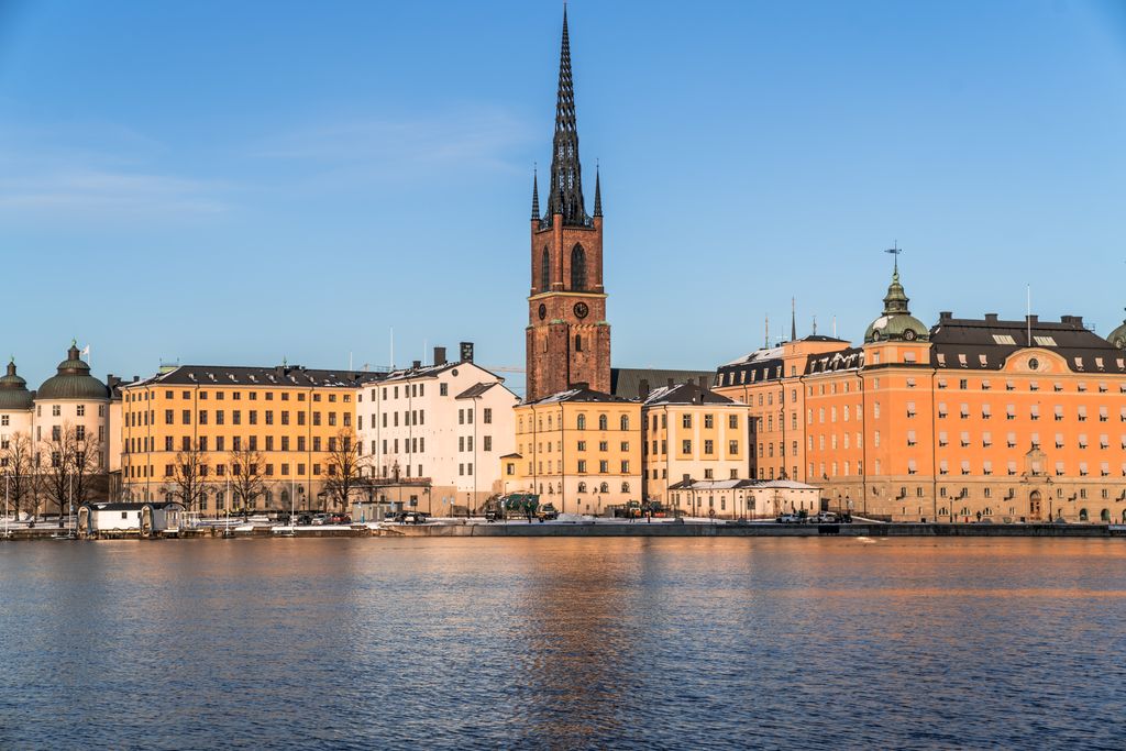 Explore the historic waterfront of Stockholm with its stunning architecture and serene waterscape.